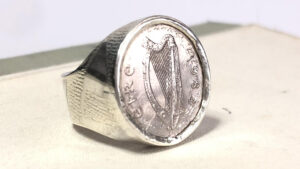 This is a silver, handmade sovereign ring with an Irish harp, engraved with "eire" and the year 1982. This ring was made in one of our Jewellery making courses at Brighton MET college