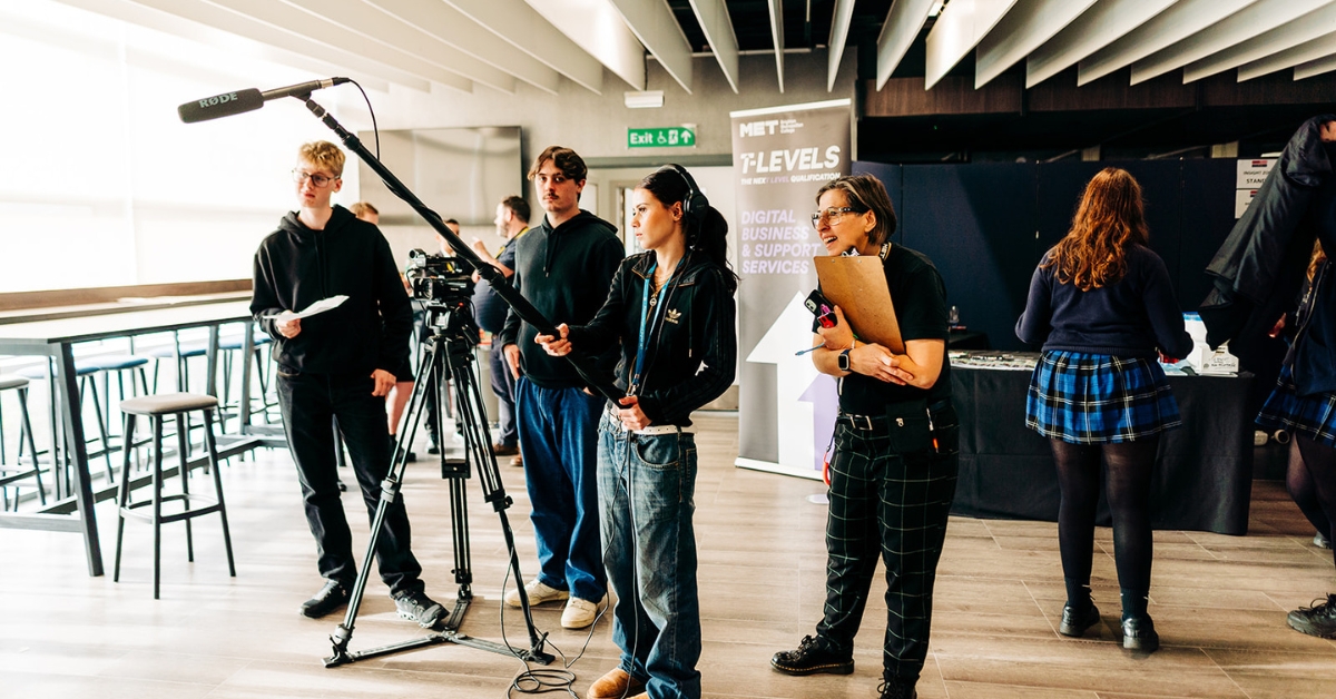 Some of our MET students working camera gear as part of the stall