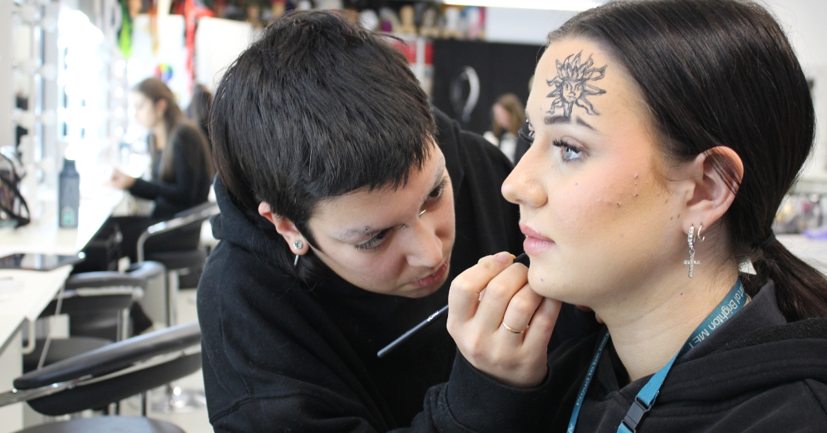 Irene working on some makeup for a fellow student