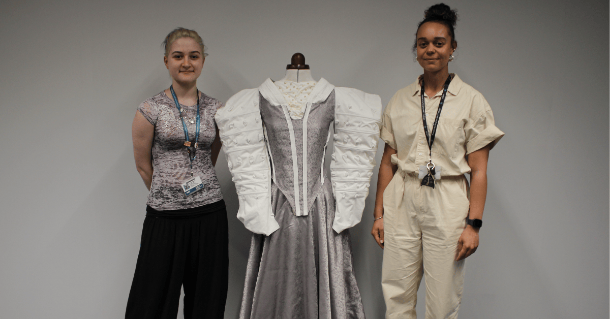 Scarlet stood with her teacher and her dress