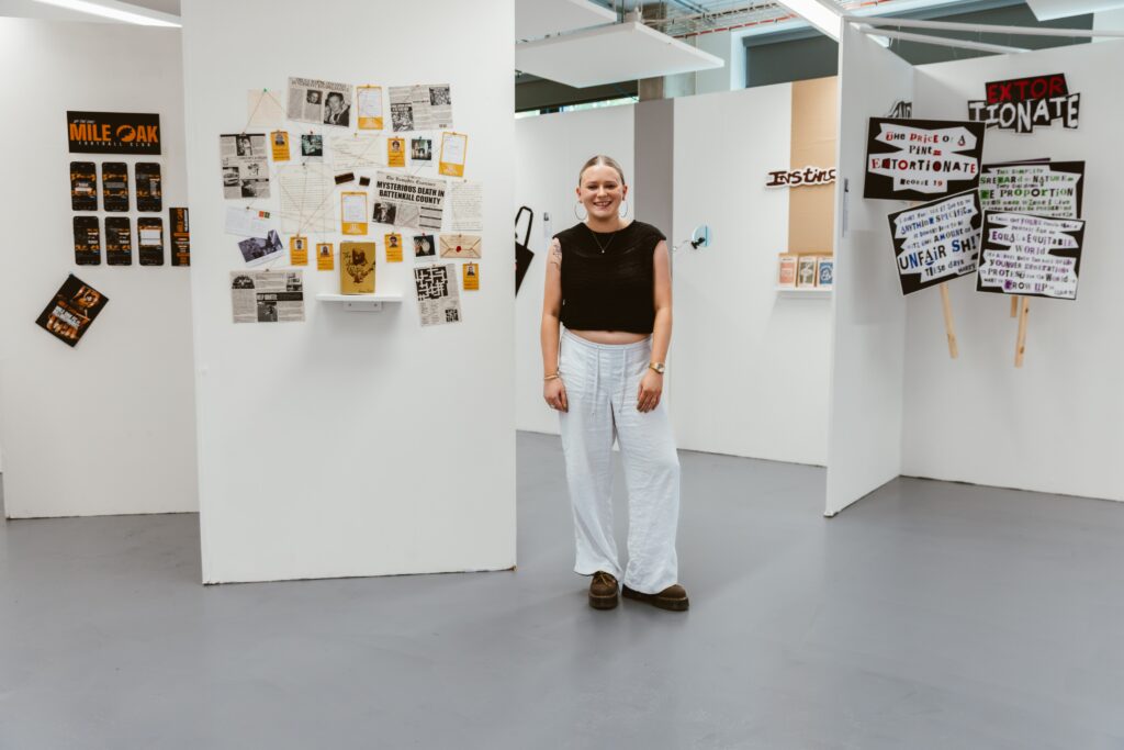 A student smiling in a Brighton MET art studio